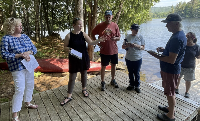 Whitney Baker trains members of Flying Pond’s volunteer LakeSmart team.